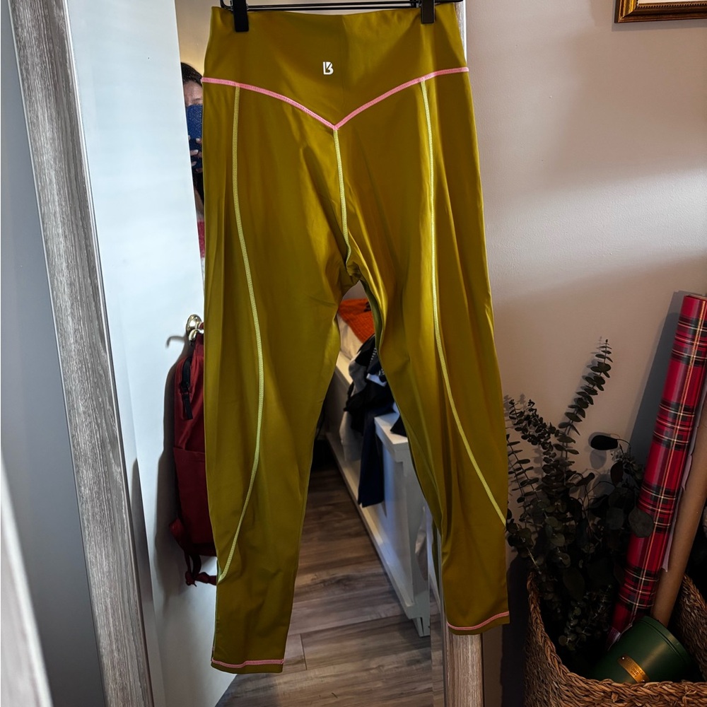 Pretty color green and love the colored stitching!! Size large! Like new